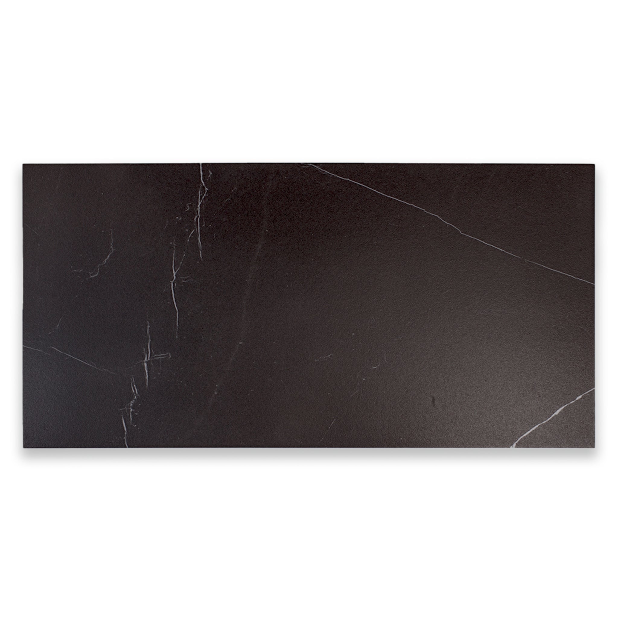 Ariel view of a single 24x48 tile in matte black marble look porcelain with white veining. 