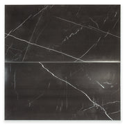 Ariel view of a two 12x24 rectangular tiles in polished glossy black marble look porcelain with thin white veining. The veining is not meant to line up as it is random. 