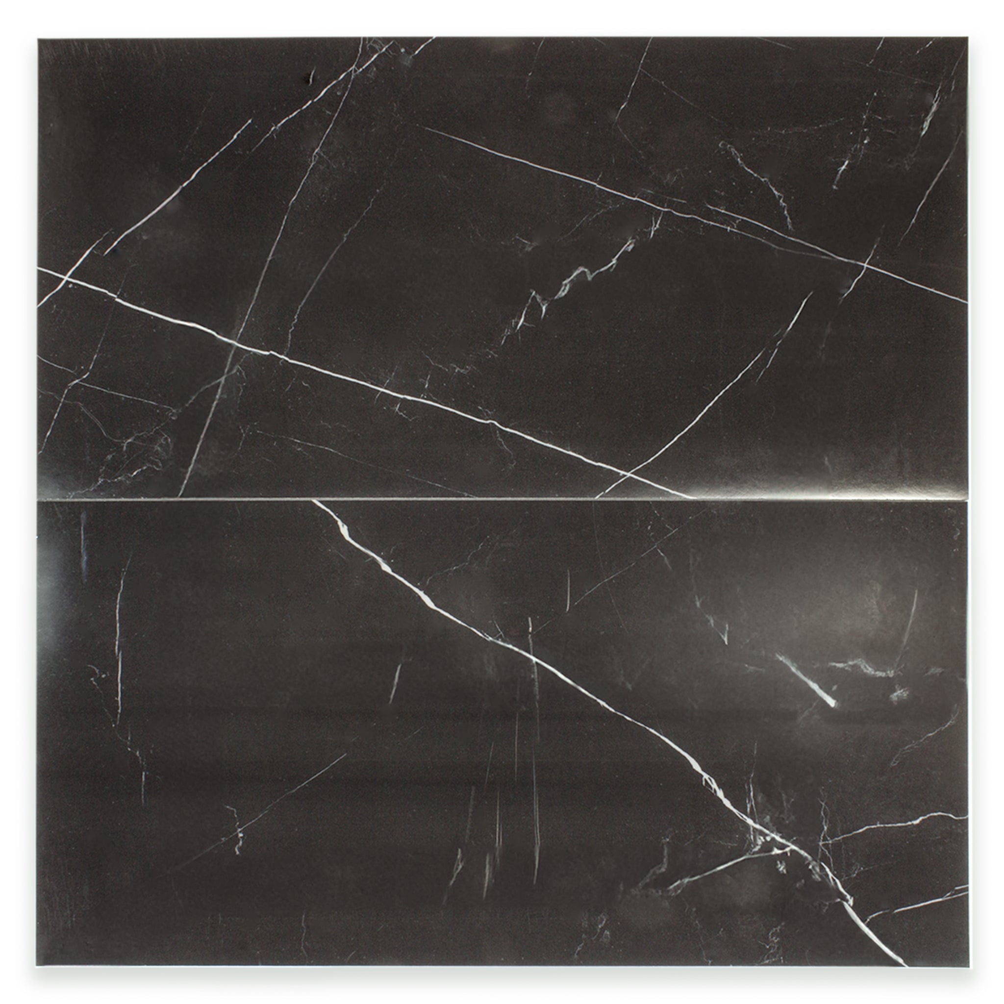 Ariel view of a two 12x24 rectangular tiles in polished glossy black marble look porcelain with thin white veining. The veining is not meant to line up as it is random. 
