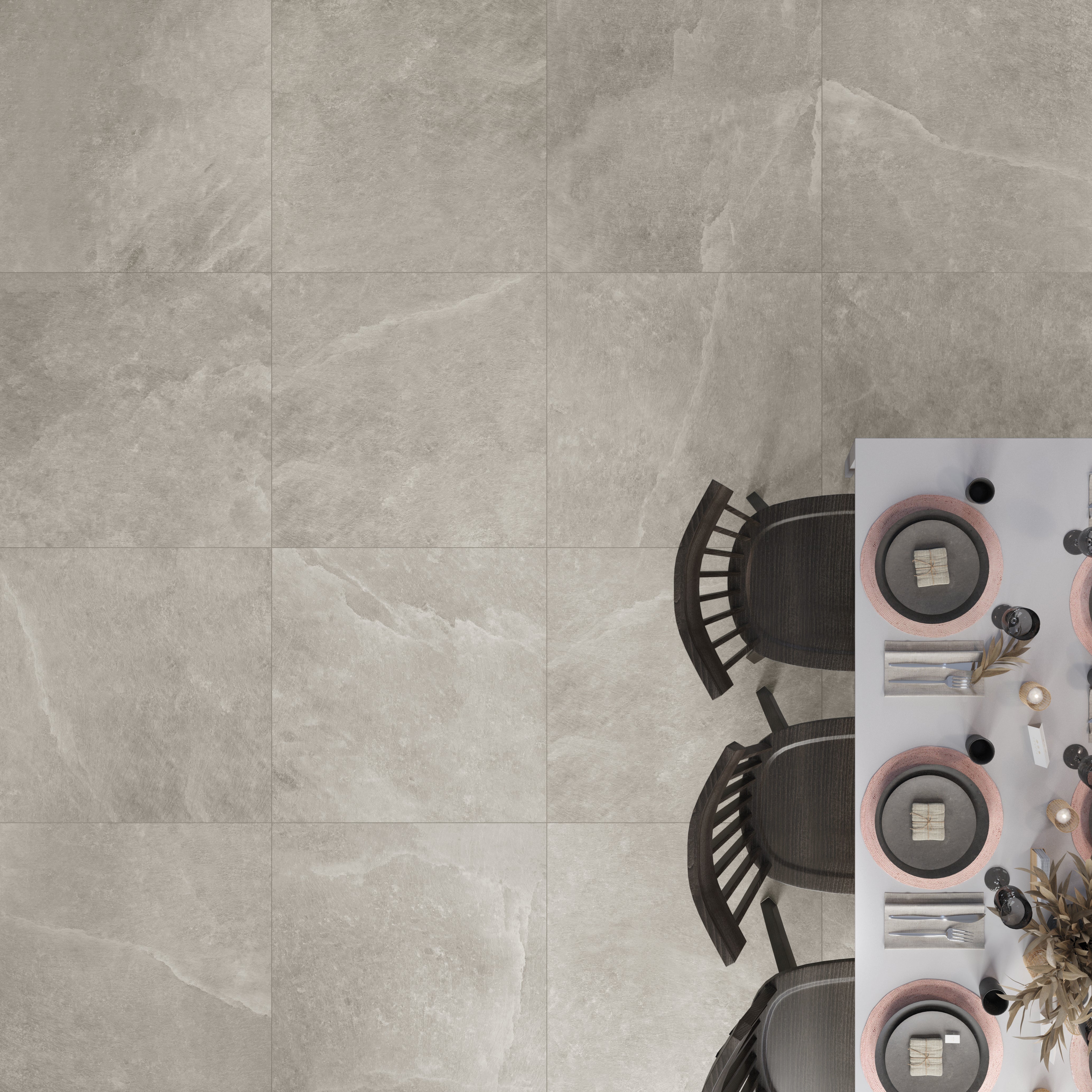 Ariel view of saltstone taupe porcelain stone look tiles used on a dining room floor. There is white veining and some beige shades throughout the tiles. 