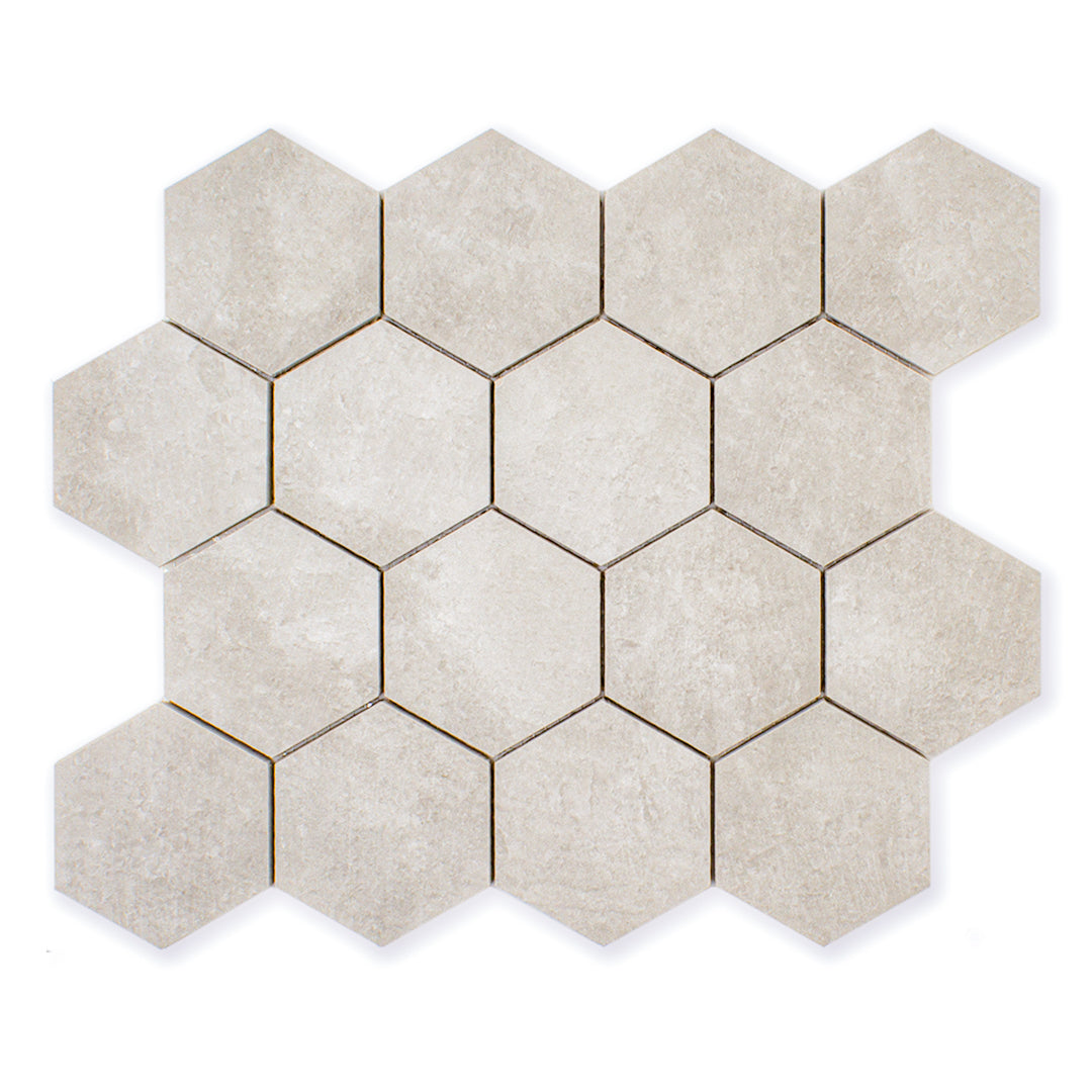 A single sheet of 3" hexagon mosaic tile in a beige stone look.