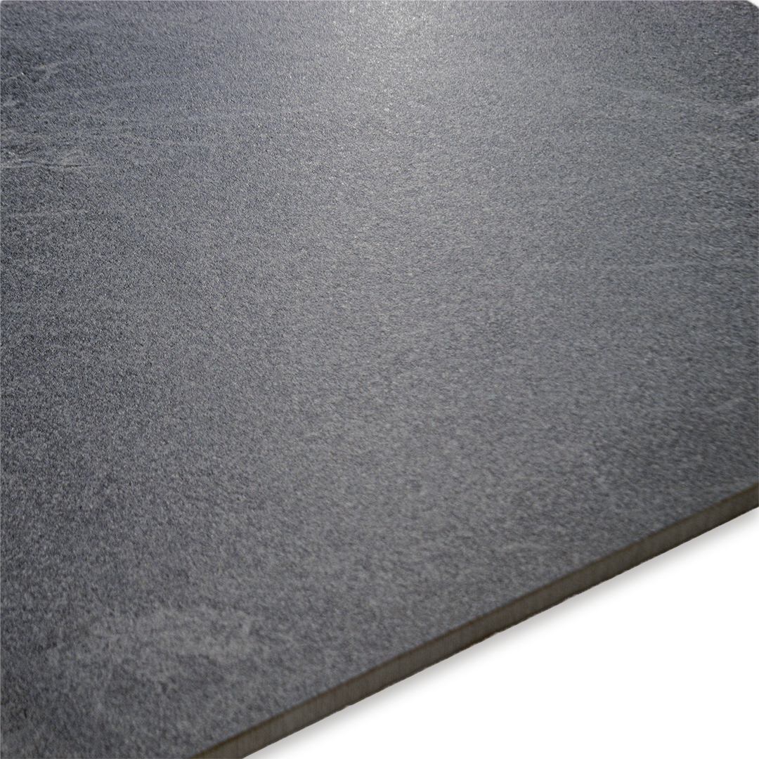 Angled close up of the colour and pattern of the dark grey stone look tile.
