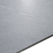 Angled close up of a ight grey large tile showing the veining and pattern. 