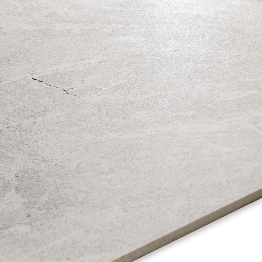 Angled close up of the colour and pattern of the white snow stone look tile.