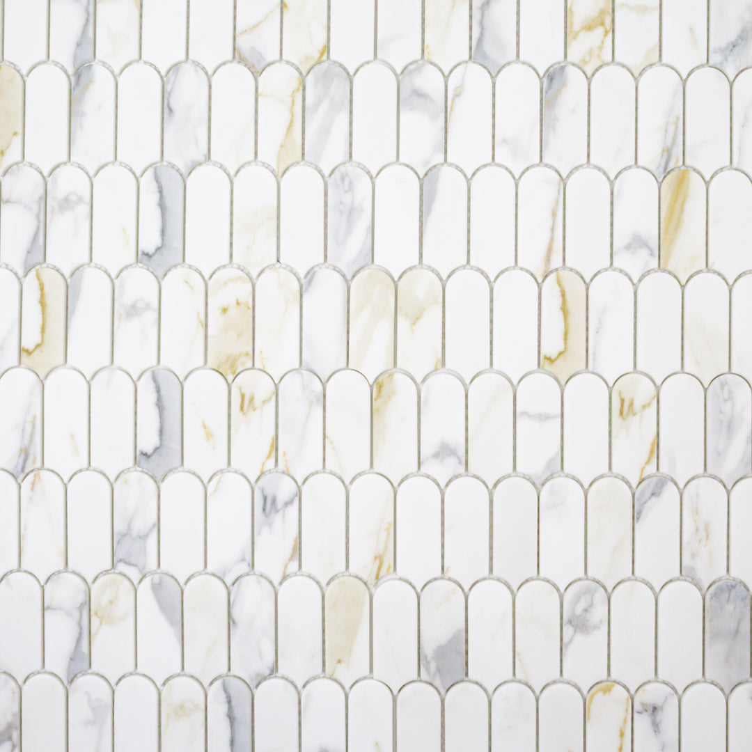 Ariel view of white and grey and golden veining marble look porcelain feather scallop mosaic tiles.