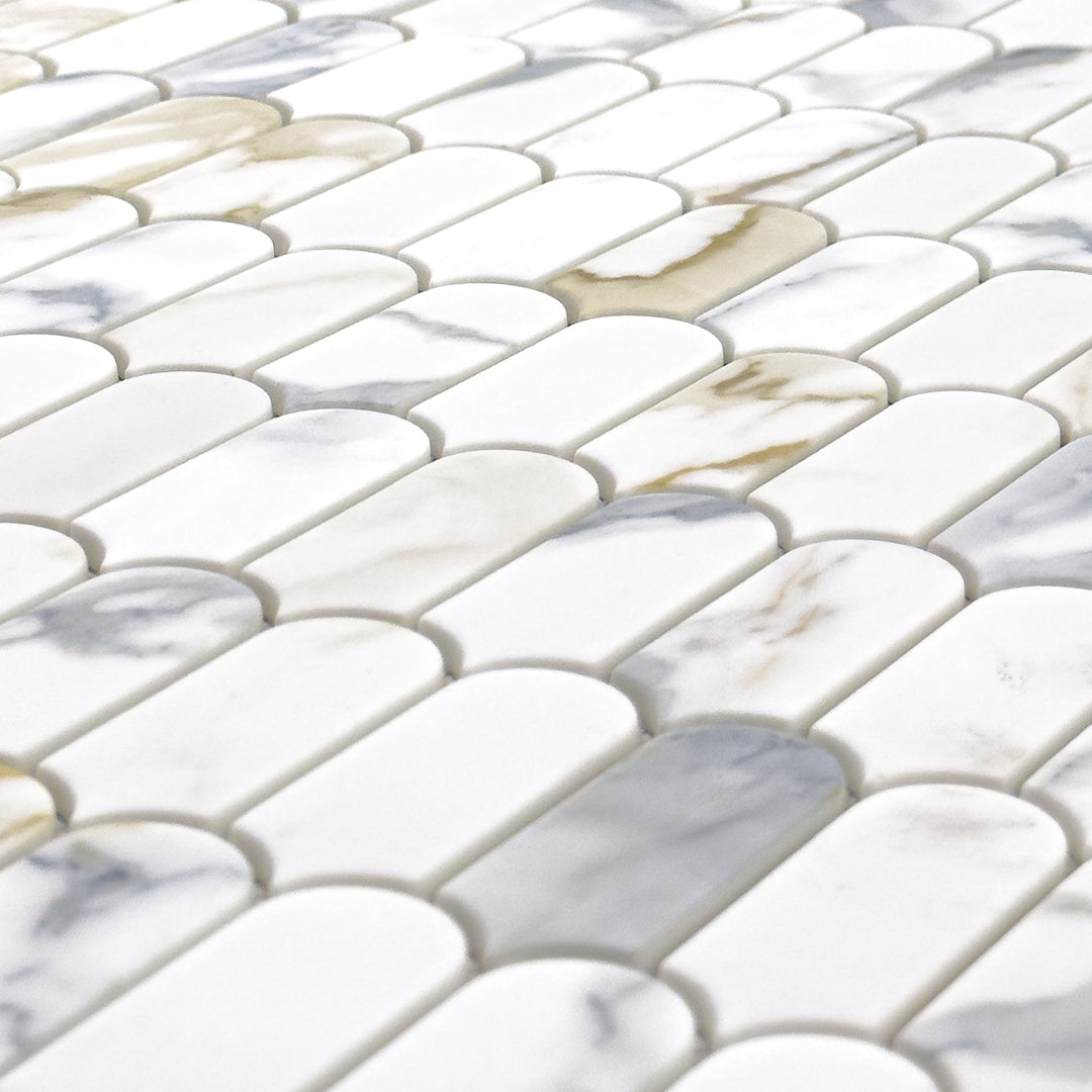 Close Up angled view of white and grey and golden veining marble look porcelain feather scallop mosaic tiles.