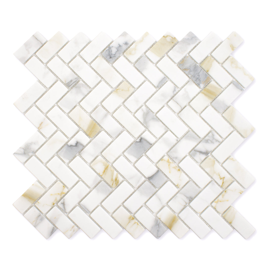 Ariel view of a single sheet of herringbone mosaic tile and the tiles are white and have a gold and grey marble veining pattern. 