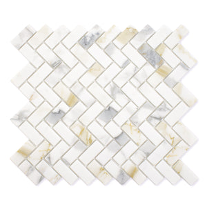 Ariel view of a single sheet of herringbone mosaic tile and the tiles are white and have a gold and grey marble veining pattern. 