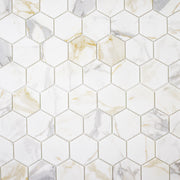 Ariel view of white and grey and golden veining marble look porcelain 3 inch hexagon mosaic tiles.