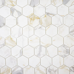 Ariel view of white and grey and golden veining marble look porcelain 3 inch hexagon mosaic tiles.