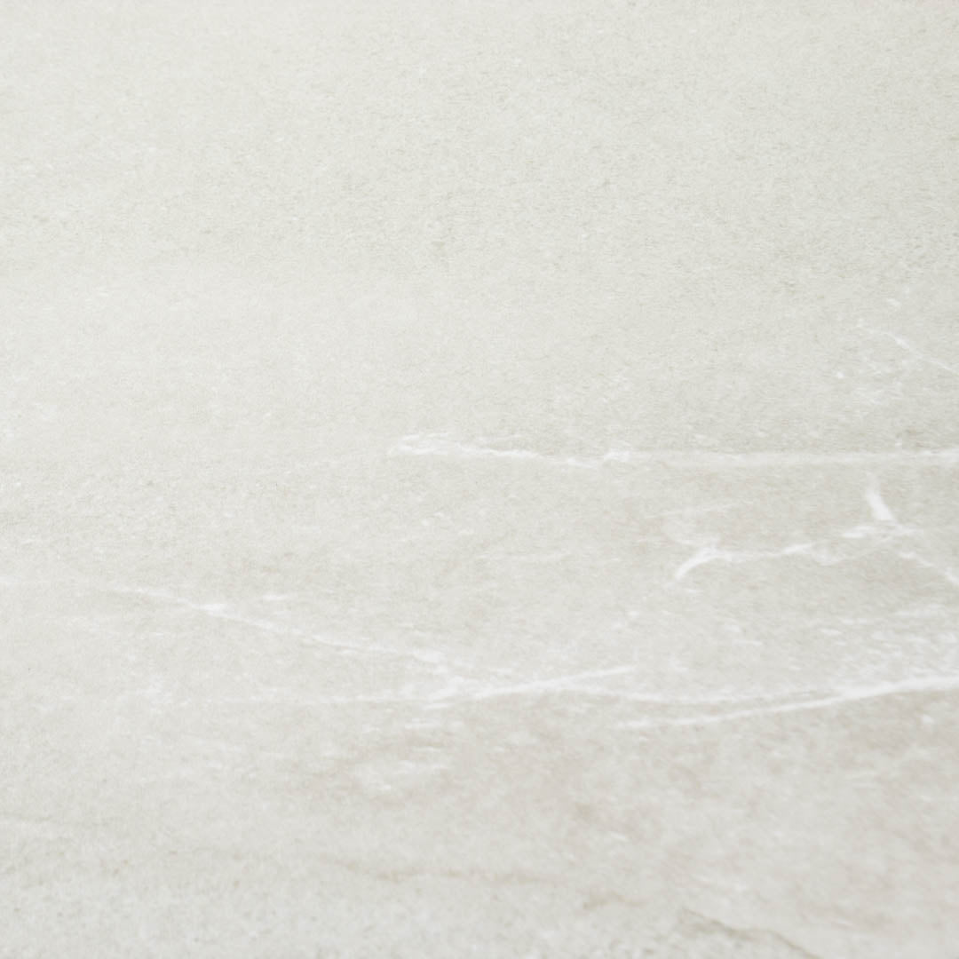 Close up to highlight the colour and veining of the 24x24 square stone light grey tile stonehaven