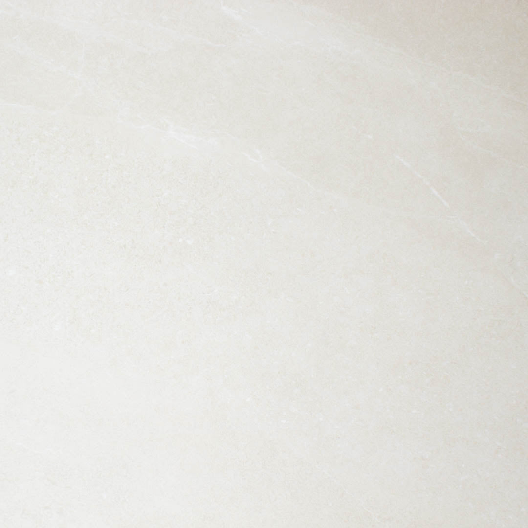 Close up of a warm and light stone look tile with fine details, colour variance and pattern in 24x48