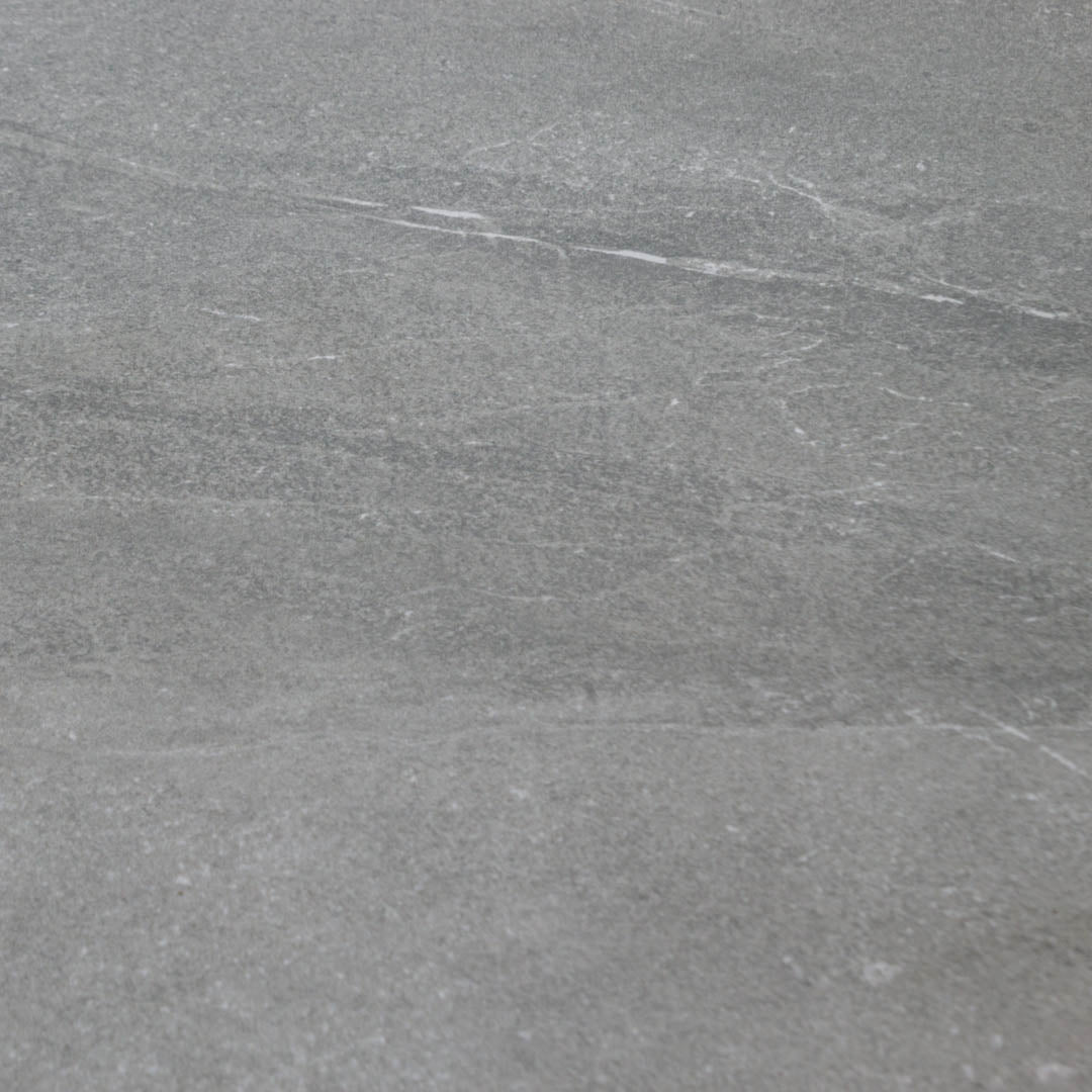 Close up to highlight the colour and veining of the 24x24 square limestone dark grey tile stonehaven