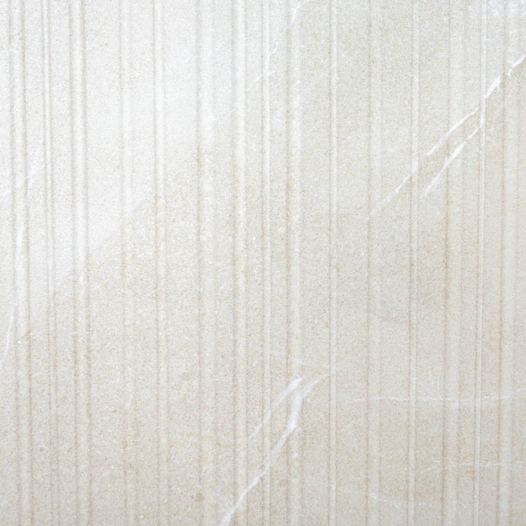 A close up of the limestone look ivory white tiles with structure pattern highlighting the depth and texture of these grooves as well as the limestone veining. 