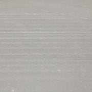 A close up of the 24x48 limestone look taupe warm grey tiles to highlight both the veining pattern as well as the three dimensional line texture across the width surface of the tile. 
