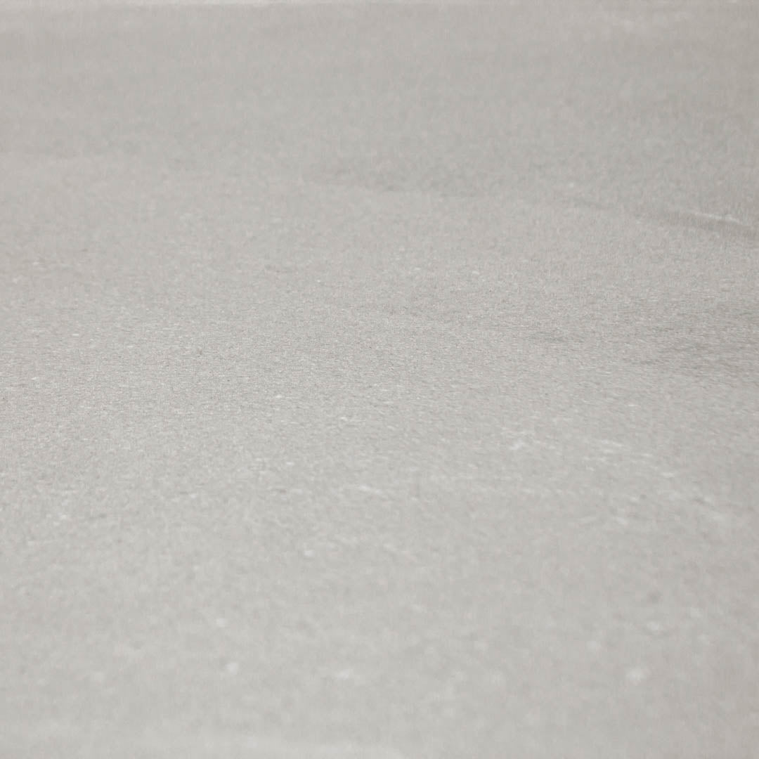 Ariel close up of 24x48 limestone look tiles in taupe to highlight the finish and pattern
