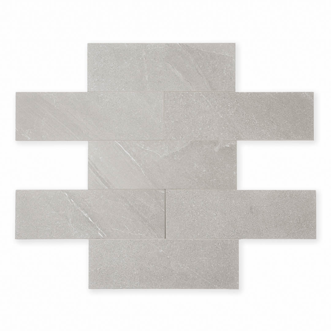 limestone look 4x12 matte tile in taupe laid out in a brick pattern to show the pattern and variance.