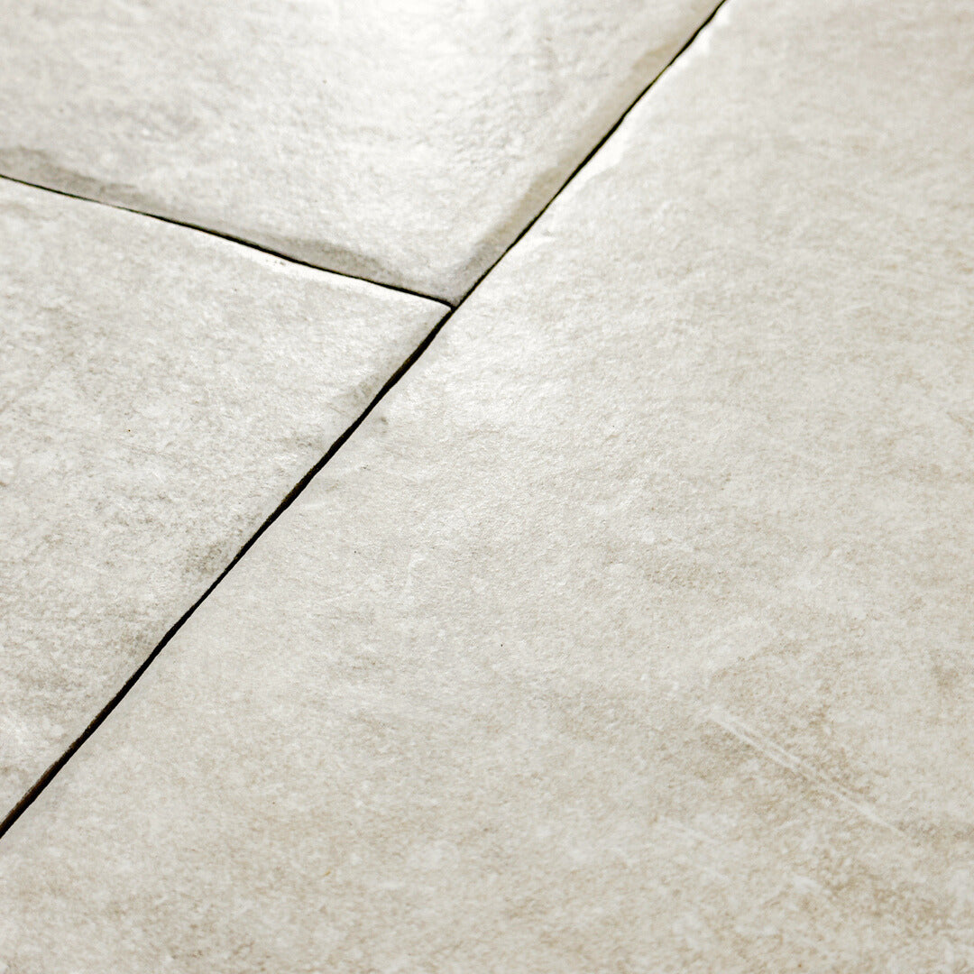 Close up view of the light grey tumbled  edges of the modular multi-format tile Cottage Chalk.