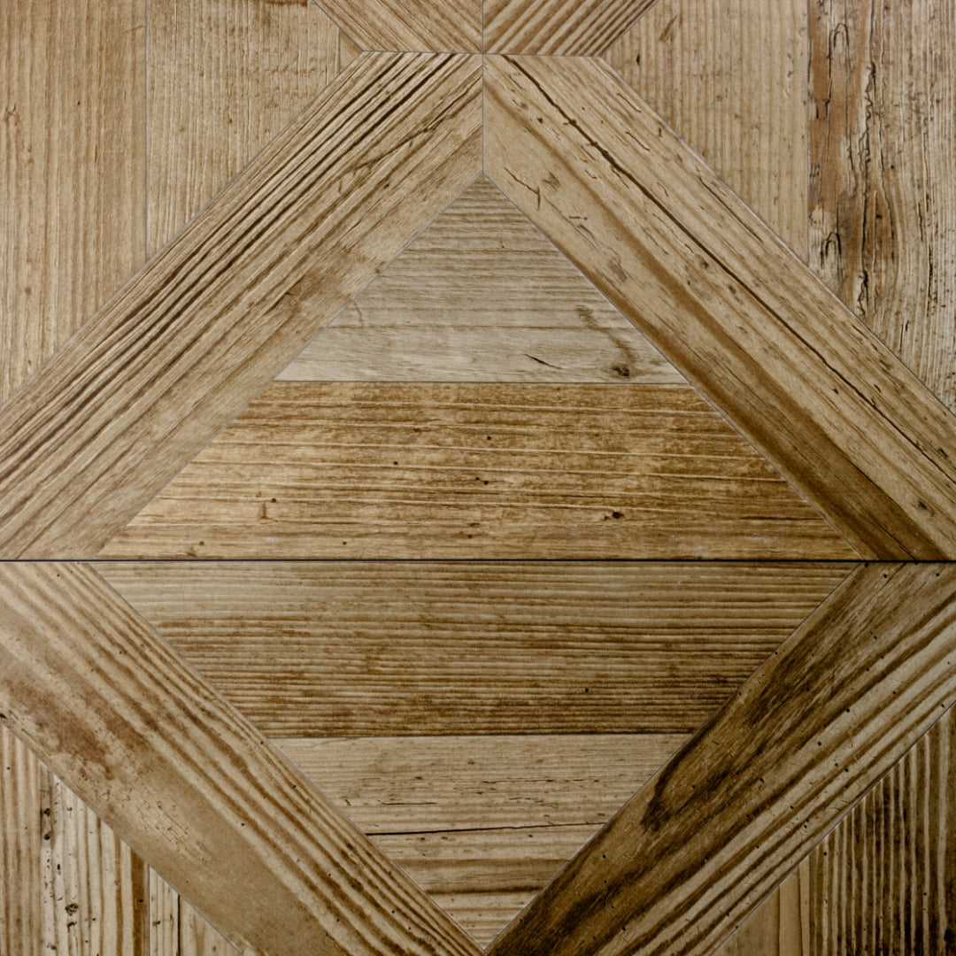 Close up of two 19x19 parquet wood look porcelain tiles in a oak blonde light brown colour. 