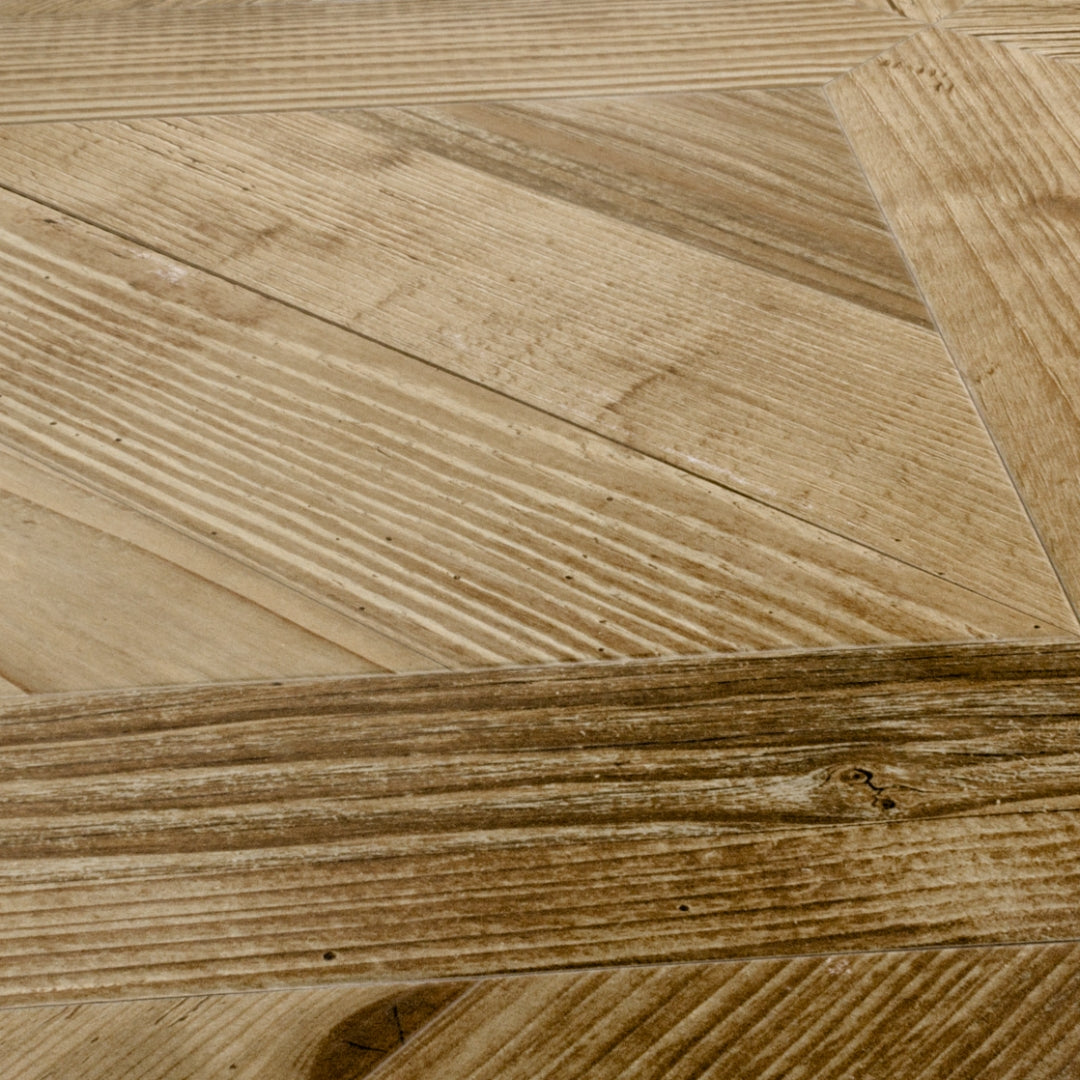 Angled close up of two 19x19 parquet wood look porcelain tiles in a oak blonde light brown colour. 