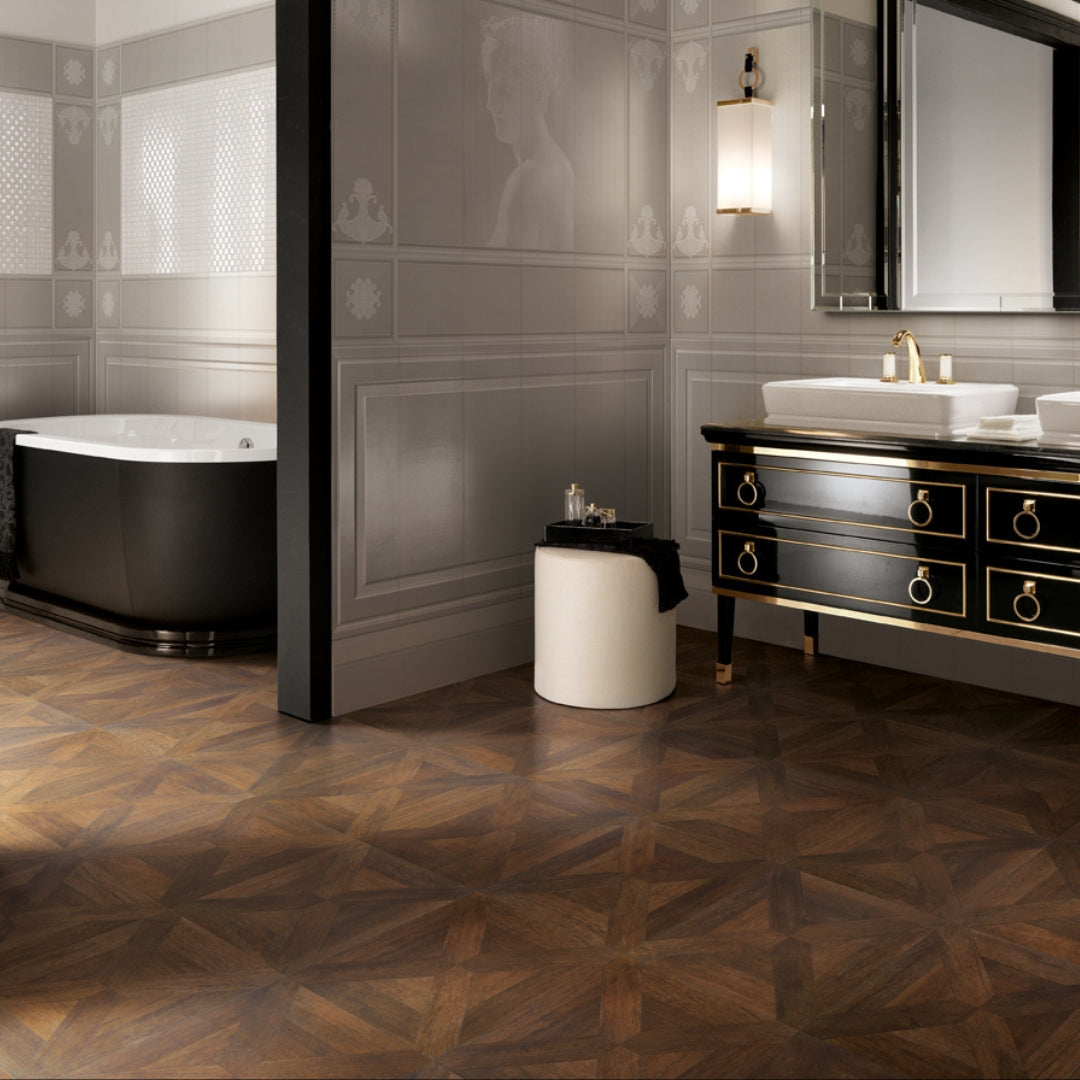A sophisticated bathroom with gray and black finishes. The floors are a parquet wood look 19x19 porcelain tile in a medium brown. 