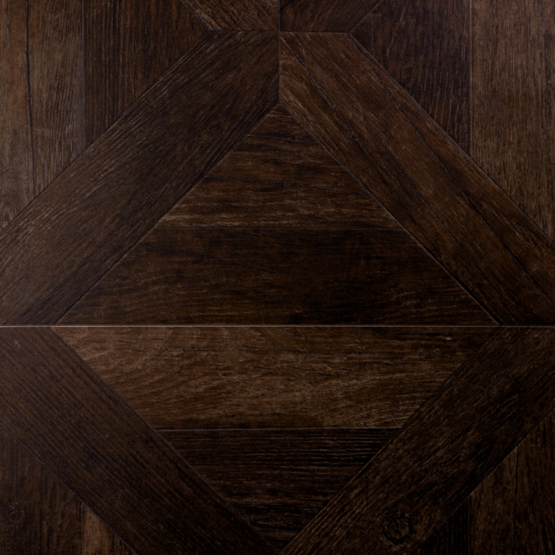 A close up of two 19x19 parquet wood look porcelain tiles in a rich chocolate brown. 