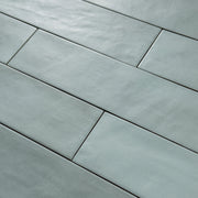 Close up detailed view of a green 2x9 matte subway tile with subtle texture. 