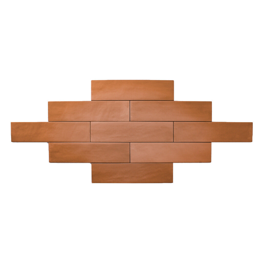 2x9 terracotta coloured matte subway tile laid out in a brick pattern ariel view. 