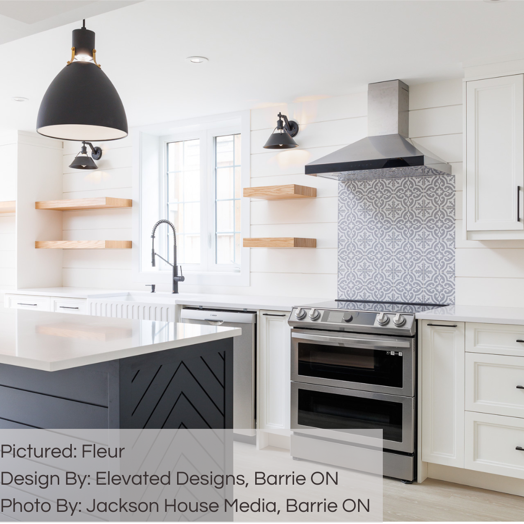 A modern white and grey kitchen with shiplap and a accent tile between the range and hood. the accent tile is traditional pattern fleur grey and white 8x8 flower look tiles. 