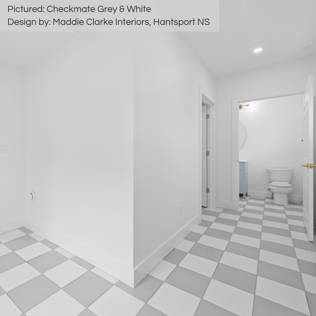 A bright hallway jazzed up with grey and white checkerboard 12x12 floor tiles that lead to a laundry room and powder room. 