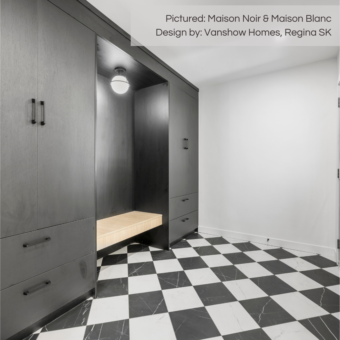 A stunning mudroom area with black cabinets and wood bench seat niche. the floors are tiles in a diamond layout checkerboard design sing marble look porcelain black and white tiles. the veining is gorgeous and it looks like natural stone with the durability of porcelain from tilesinspired. 