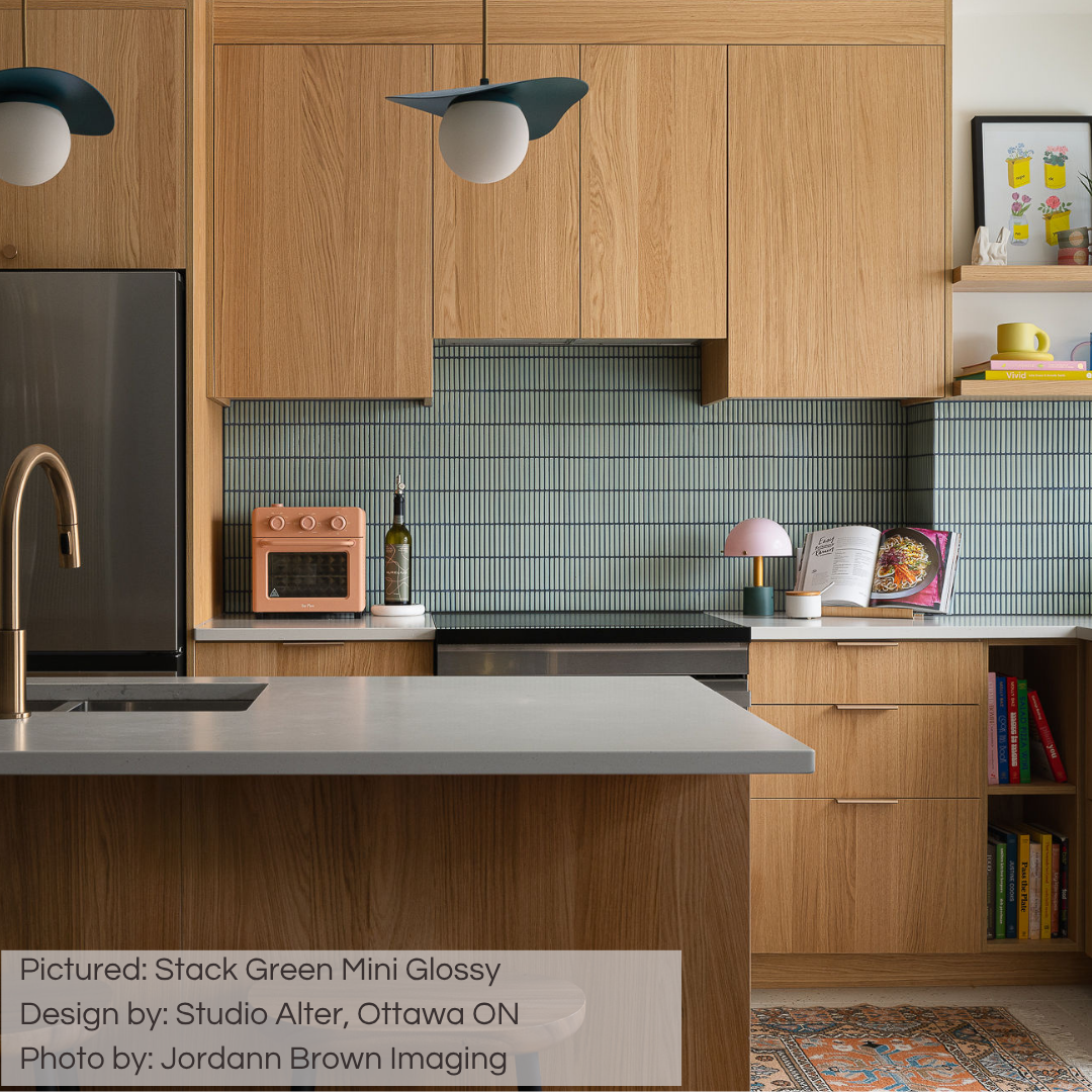 A mid centry modern oak kitchen with white counters. The backsplash tile is our stack green mini glossy kitkat mosaic tile. 