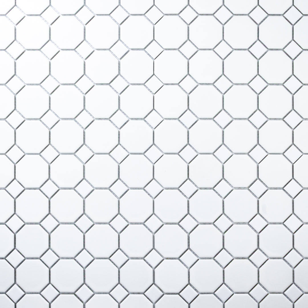 A zoomed our ariel view of a single sheet of Octa-Dot White, a classic timeless geometric pattern white octagon and dot penny mosaic tile. 