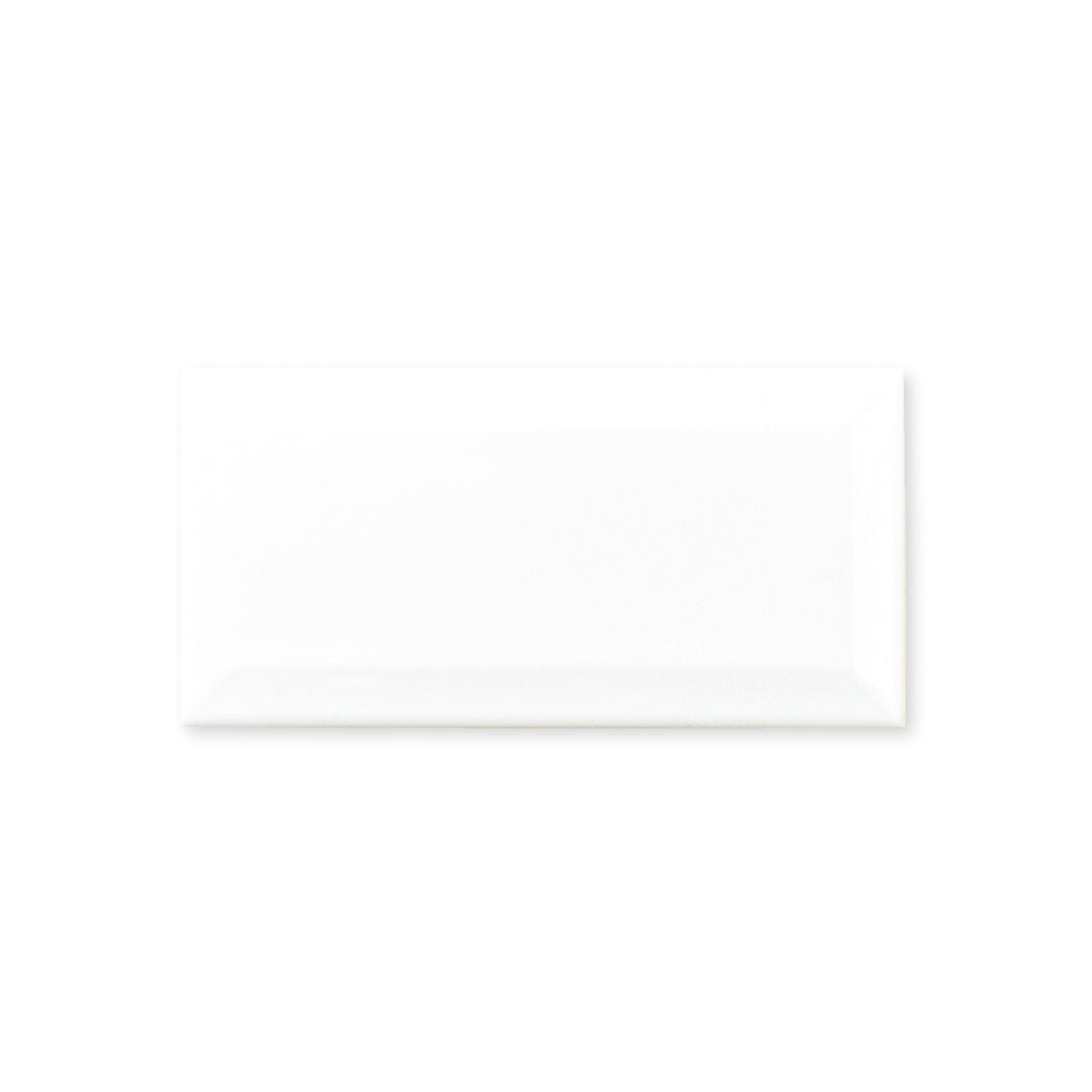 Ariel view of a single 3x6 white beveled glossy tile. 