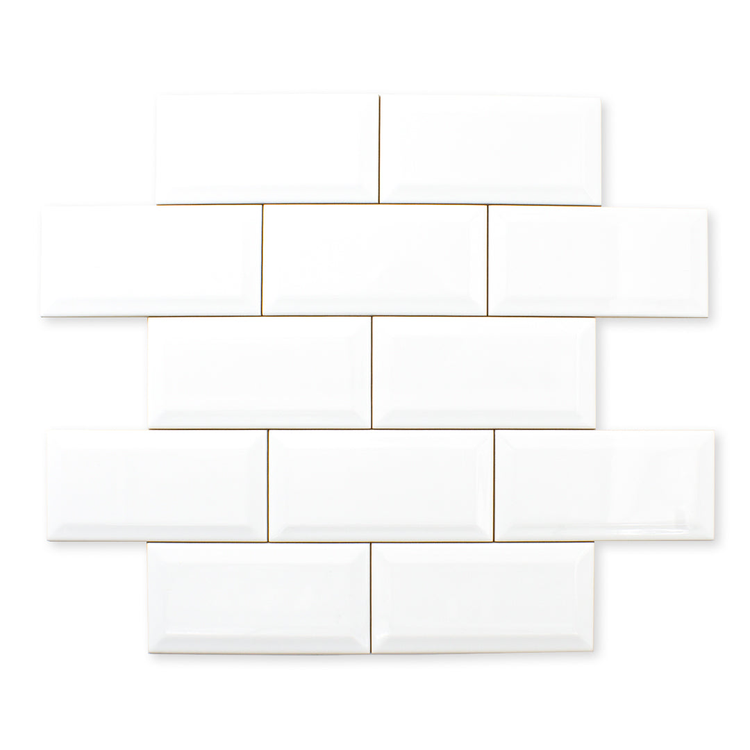 Ariel view of 3x6 glossy beveled white tiles in a standard brick layout. 