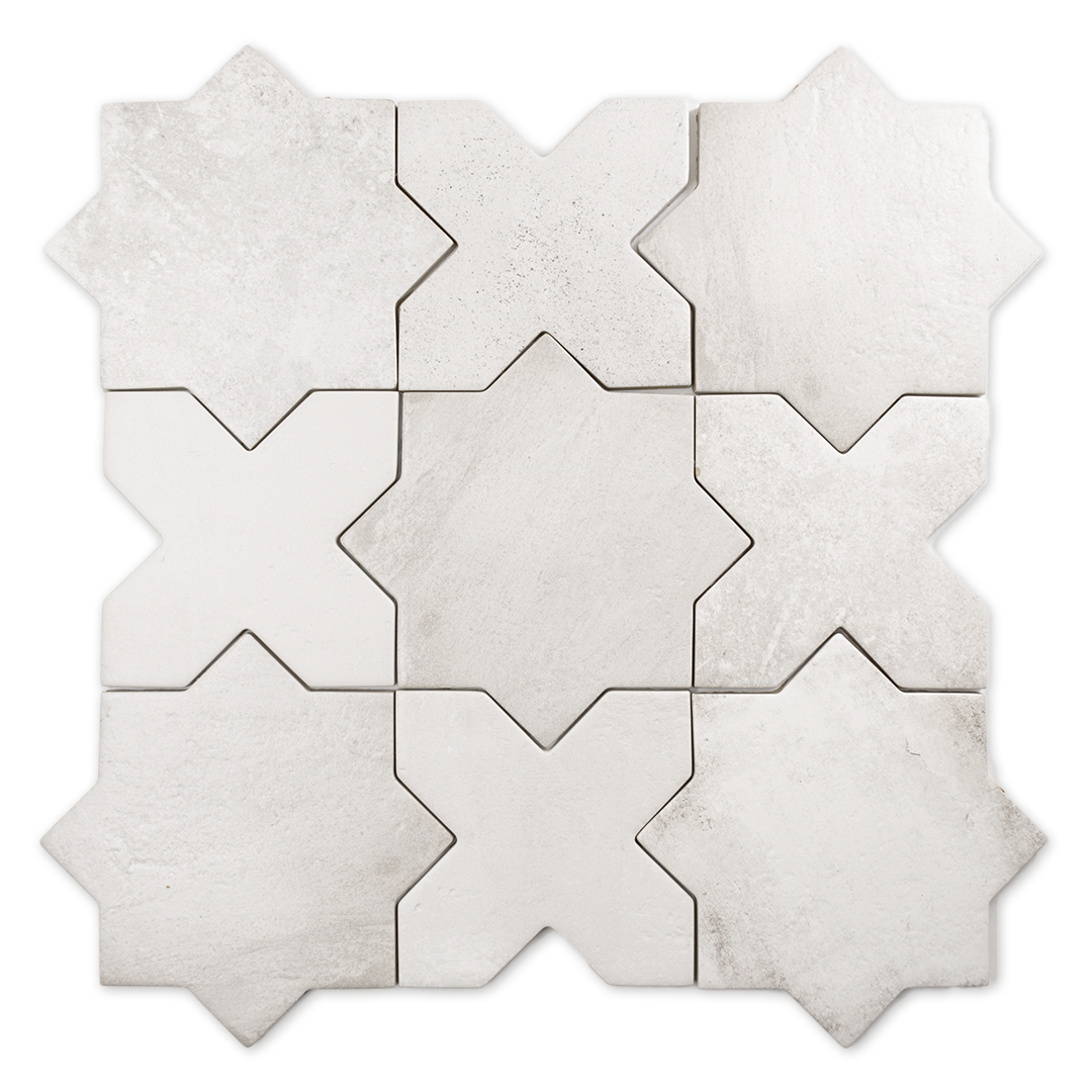 A group of star and cross shaped tiles interlocking together in a matte white finish