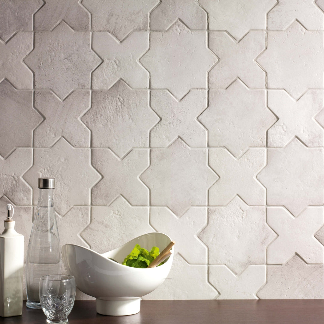 A backsplash install of our bone white star and cross tiles showing the texture and colour variation. 