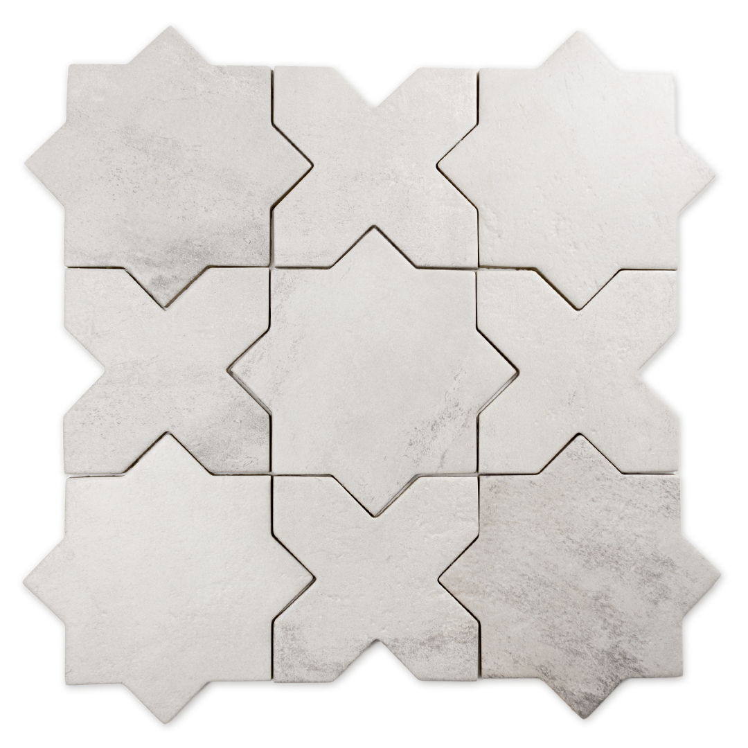 A group of star and cross shaped tiles interlocking together in a matte grey finish