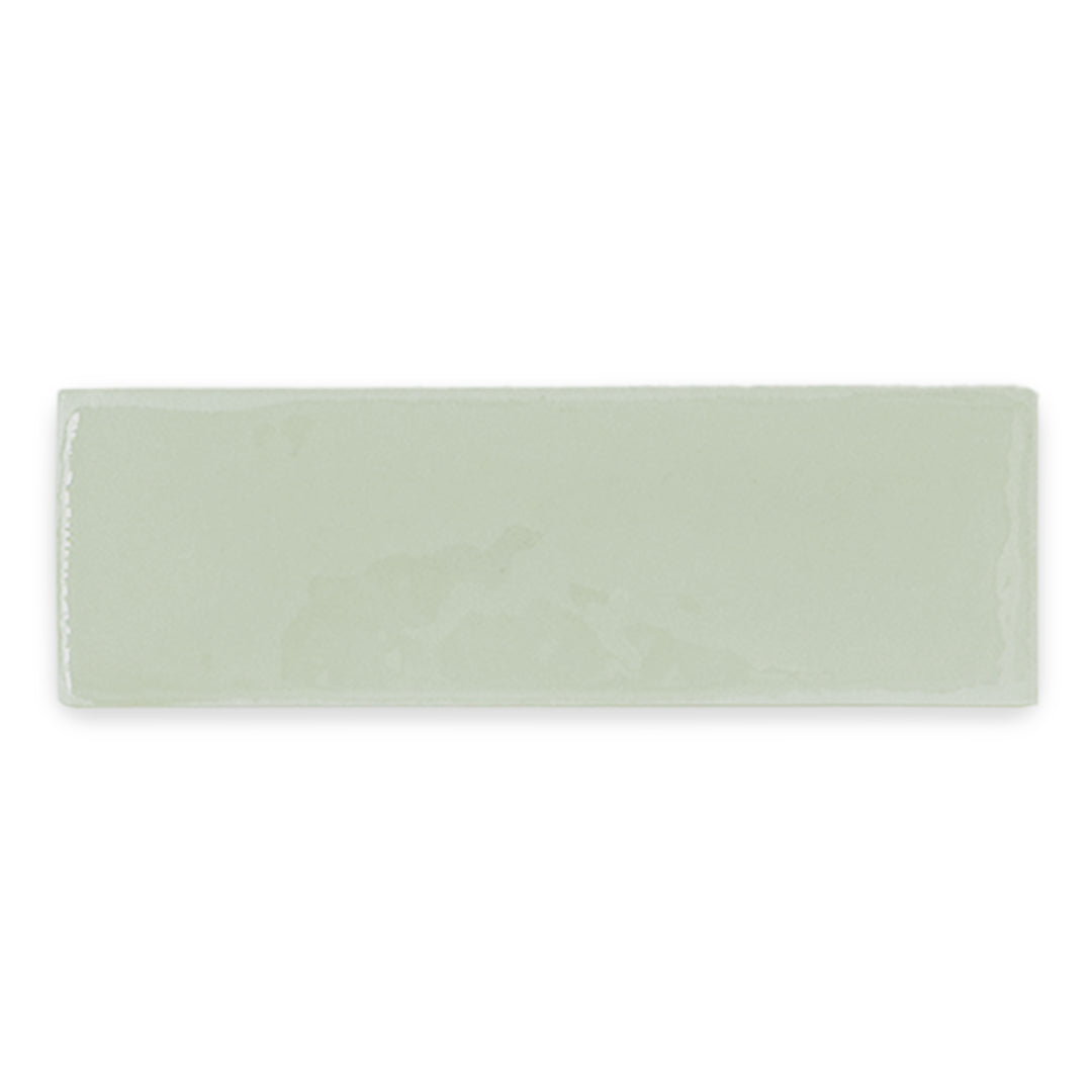 a single 2x6 glossy light green woodland sage subway tile. 
