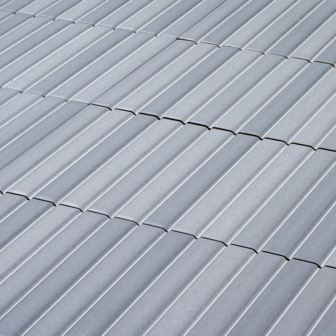 a group of fluted kitkat style panel in matte ash blue grey with a soft colour variation