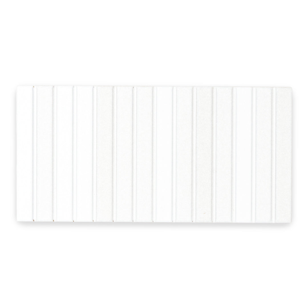 a single white fluted kitkat style wall tile in matte 4.5x9