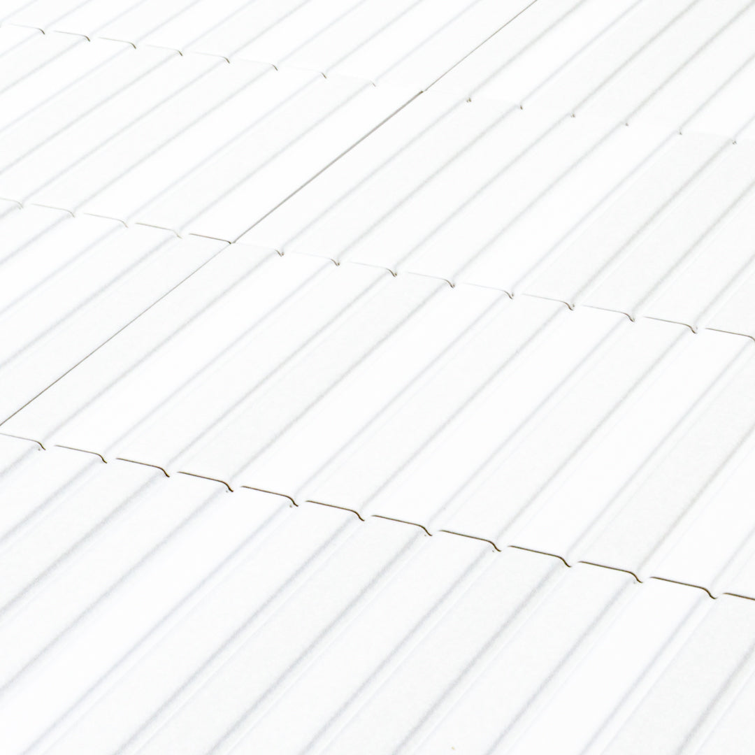 a group of fluted kitkat style panel in matte white with a soft colour variation