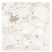 Ariel view of two rectangular offwhite Rainstone powder terrazzo look tiles. 
