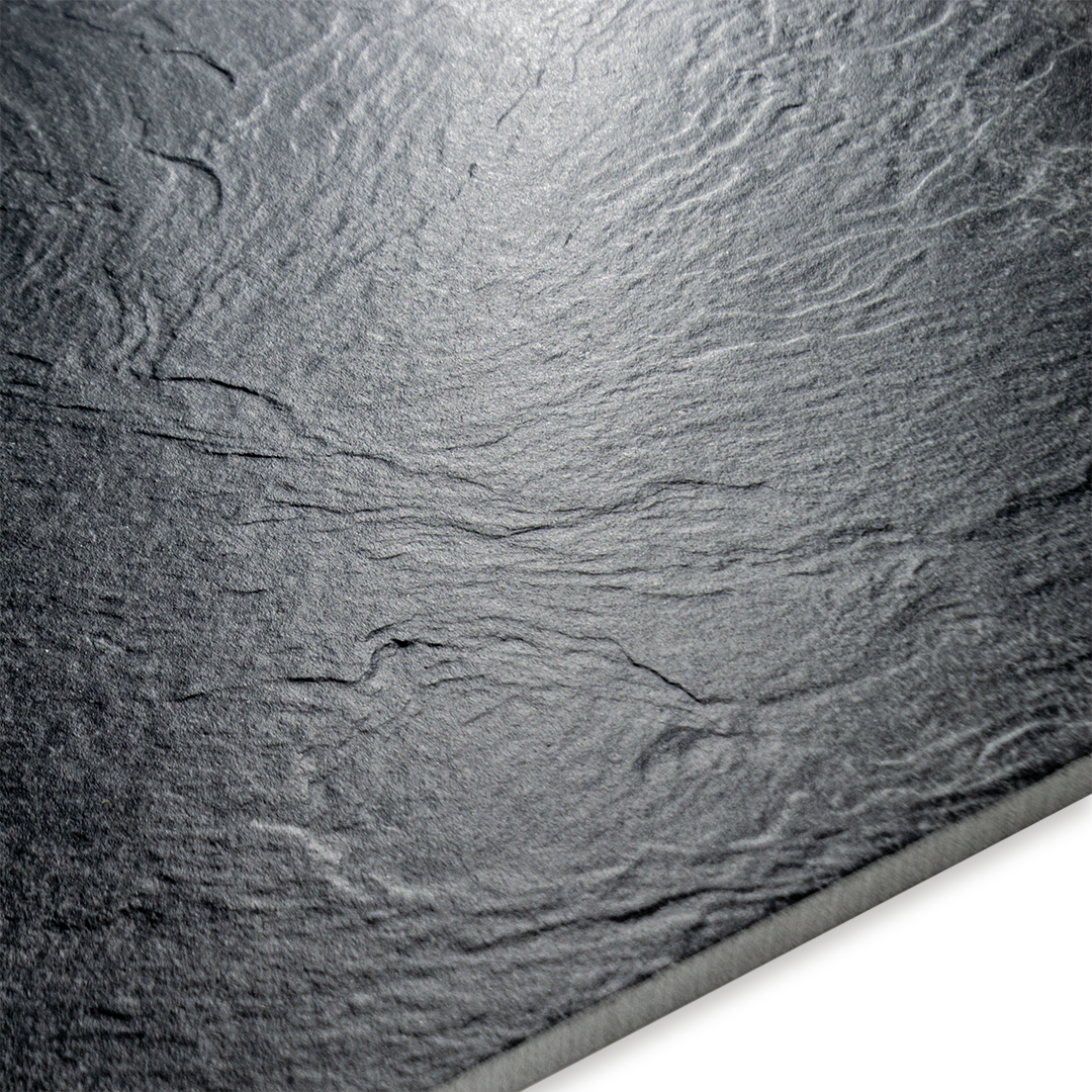 Angled close up on a slate black tile to highlight the texture and finish. 