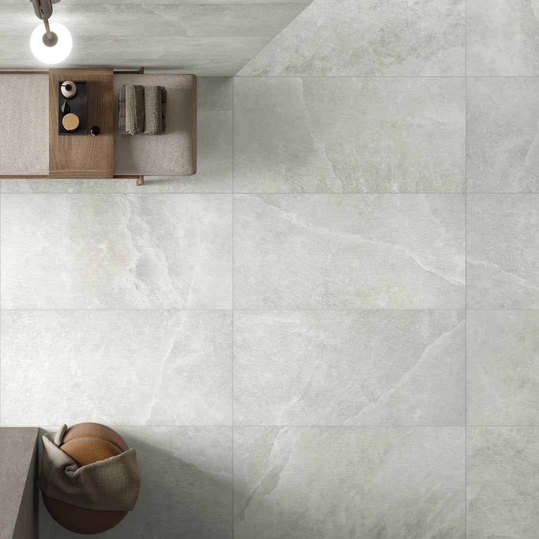 Ariel view of saltstone light white stone look tiles on a modern floor setting. 