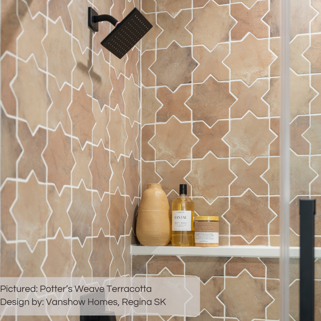 A close up of an upper shower section where the two shower walls meet and the terracotta star and cross potter's weave tile colours are mixed in their nice variation. they are grouted with a light colour grout to match the shower shelf