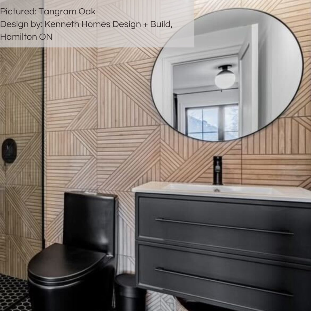 A modern black bathroom with a backsplash and shower feature wall of tilesinpired tangram oak wood look geometric 3d tiles. 