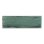 A single 2x6.5 dark eucalyptus brushed green bars glossy subway tile. 
