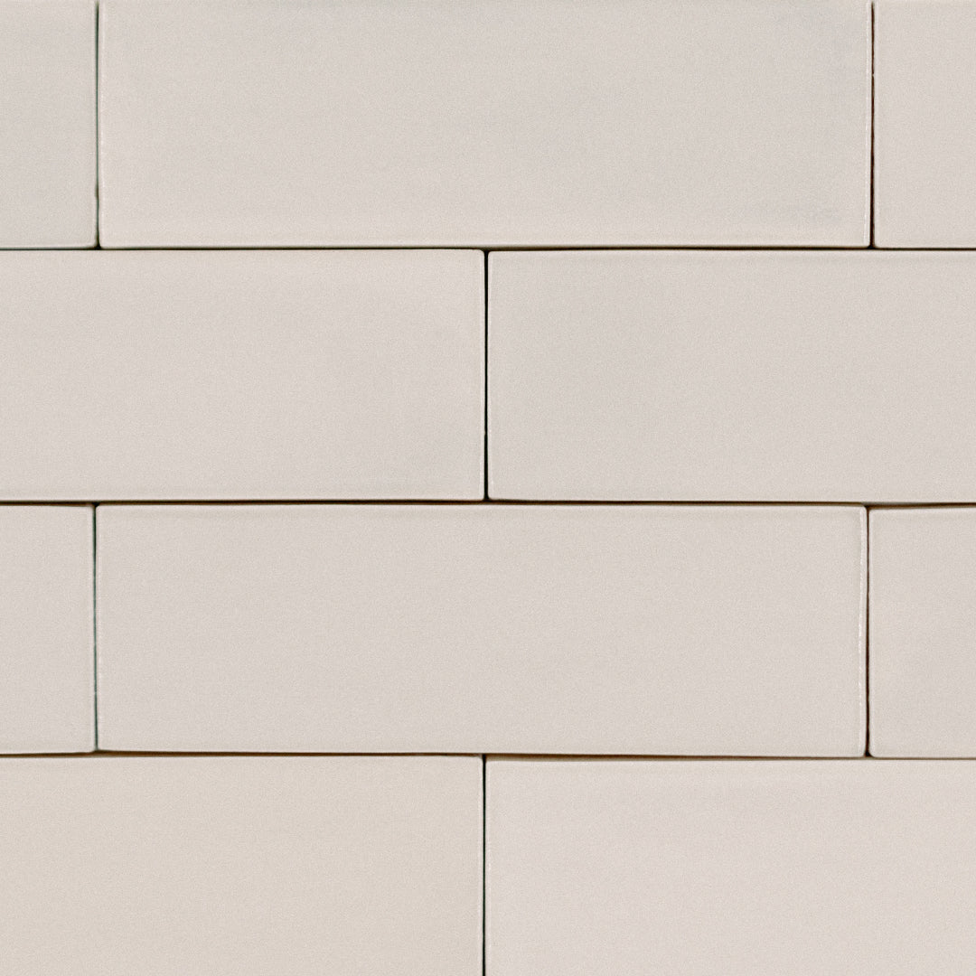 a brick tile layout flat lay, the tiles are 2x6.5 glossy bars subway tiles in biscuit sepia beige cream taupe with heavy colour variation 