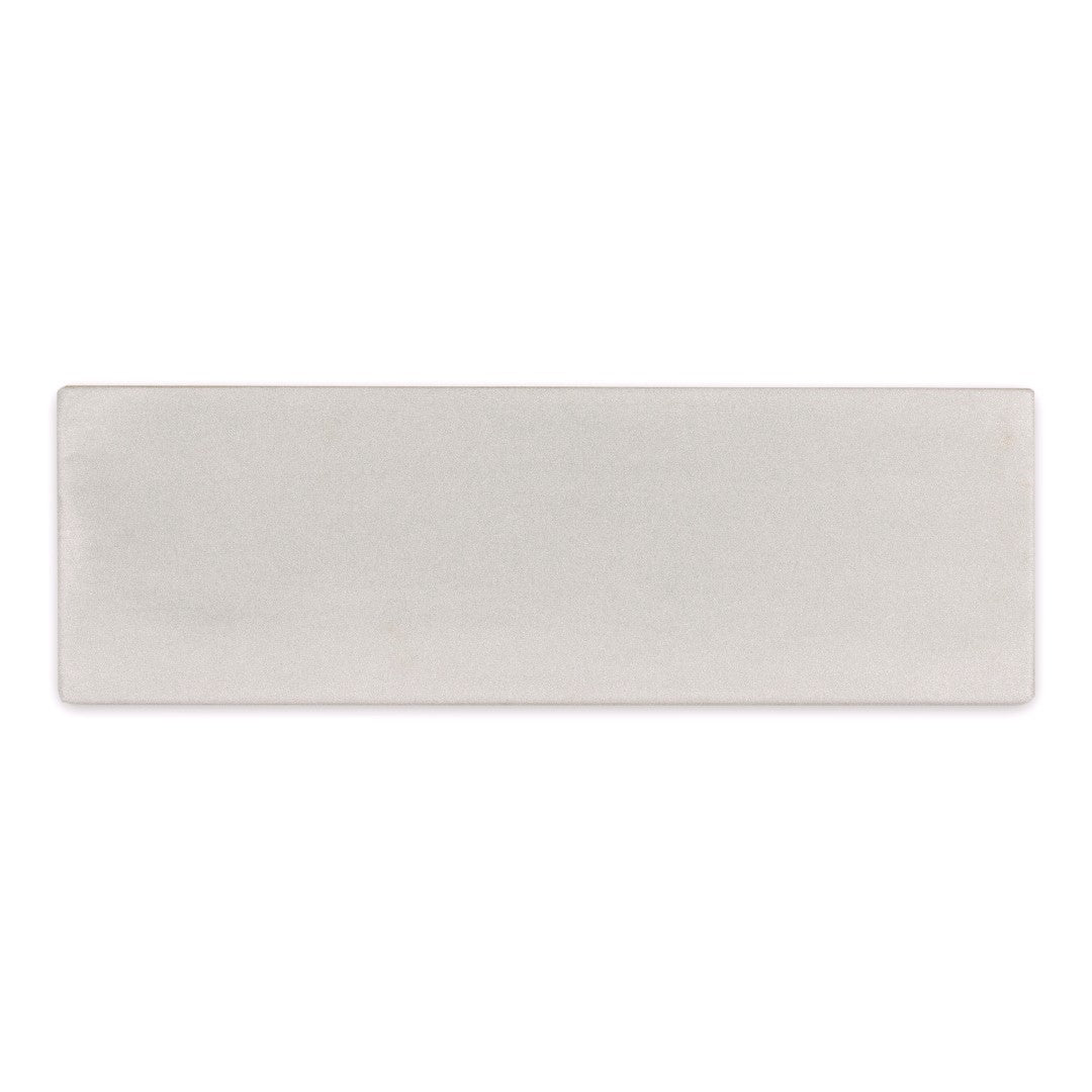 A single 2x6.5 milkstone bars matte subway tile. 